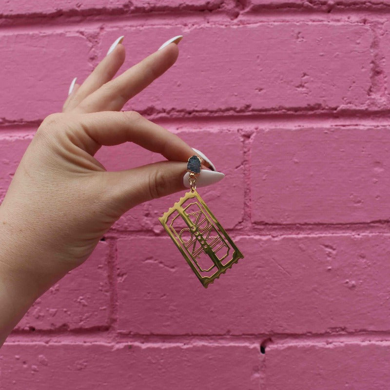 "Golden Ticket" 18K Gold Statement Earrings shaped as a Ticket with text that reads Admit One featuring Aquamarine rough cut crystals