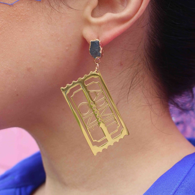 "Golden Ticket" 18K Gold Statement Earrings shaped as a Ticket with text that reads Admit One featuring Aquamarine rough cut crystals