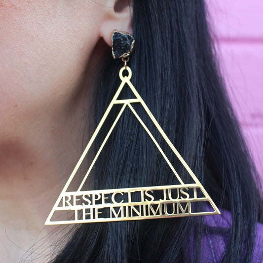 18K Gold Statement Earrings of a geometric triangular shaped design with the words "Respect is just the minimum" along the bottom edge of triangle. featuring Black Obsidian rough cut crystals.